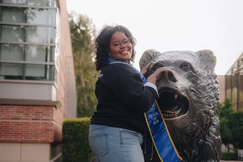 Becoming a doctor: Ky'Tavia Stafford-Carreker with UCLA Bruin bear