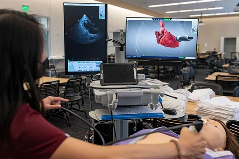 Life of a Medical Resident A medical student using an ultra sound device in a simulation environement