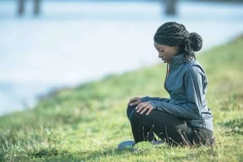 Woman sitting on grass