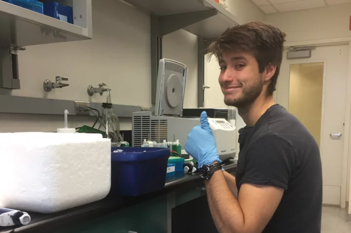Medical student Eric Smith, pictured working in a lab, shares his story of becoming a doctor