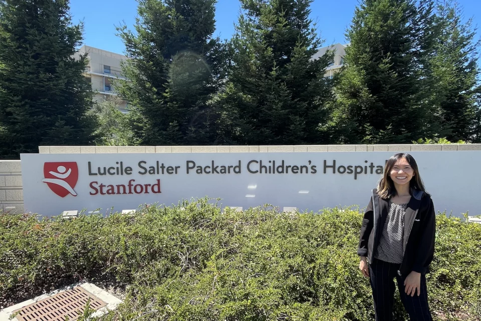 Molecular, Cellular, and Integrative Physiology (MCIP) PhD program student Rochelle Lai, pictured in front of Stanford Children’s 