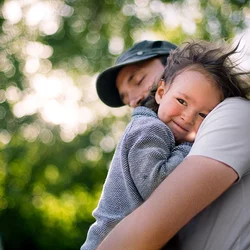 Caring for Autism Patients Man Holding Child