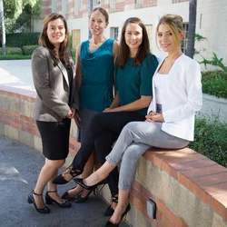 four women sitting together