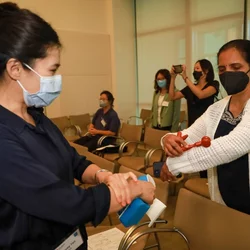 Guests at a hands-on workshop introducing self-care tools experiment with self-massage to loosen tight muscles. (Photo by Yuchen Ling/UCLA Health)