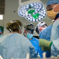 Trauma Surgeons vs ER Doctors View of Busy Operating Room