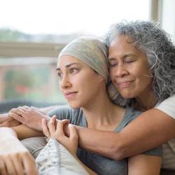 Types Of Oncology Specialists Mother Hugging Daughter Undergoing Chemotherapy