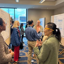 People talking at the UCAAN Symposium