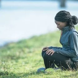 Woman sitting on grass