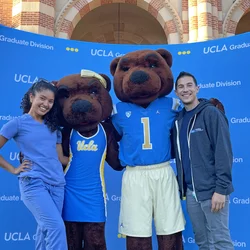 Rigoberto Perez Hernandez, pictured here with fellow UCLA resident and the Bruin mascots, shares his story of becoming a doctor 