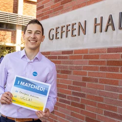 Medical student Rigoberto Perez Hernandez pictured with his residency match results