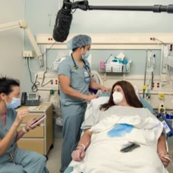woman patient with male doctors 