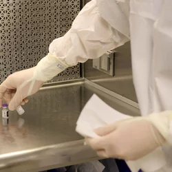 scientist holding needle