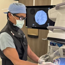 Physiatrist Dr. Allen Chen, pictured here preparing for a procedure